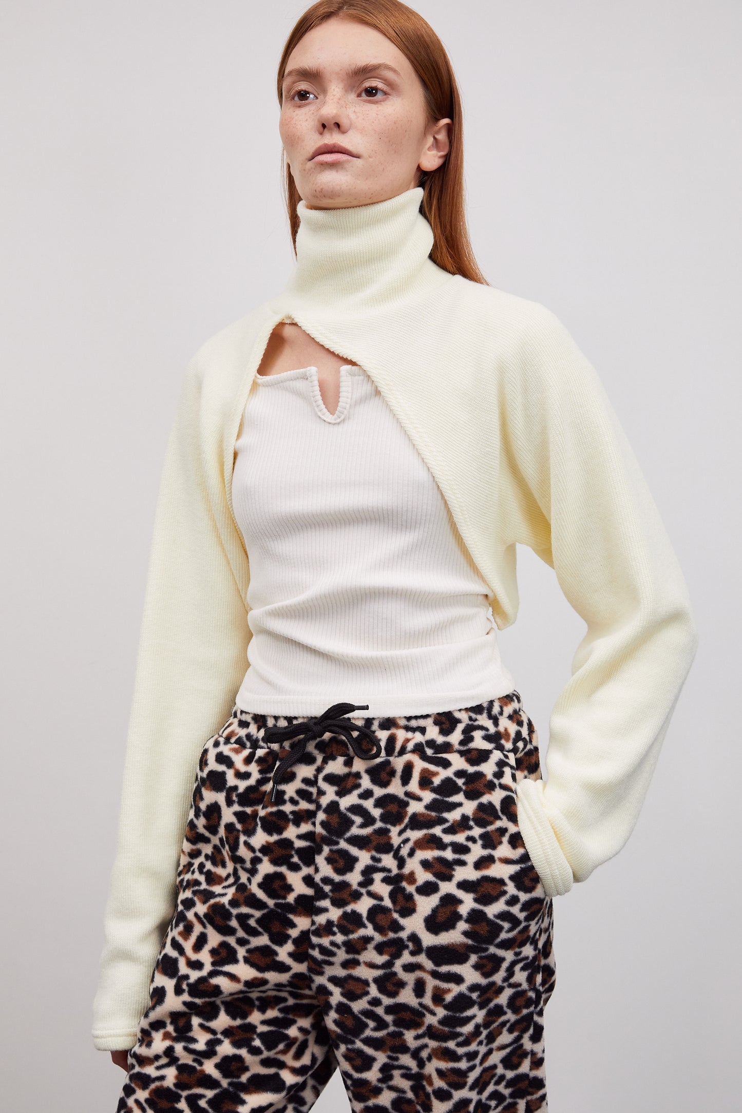 Asymmetric Curved Bolero Turtleneck Rib Knit, Cream Yellow