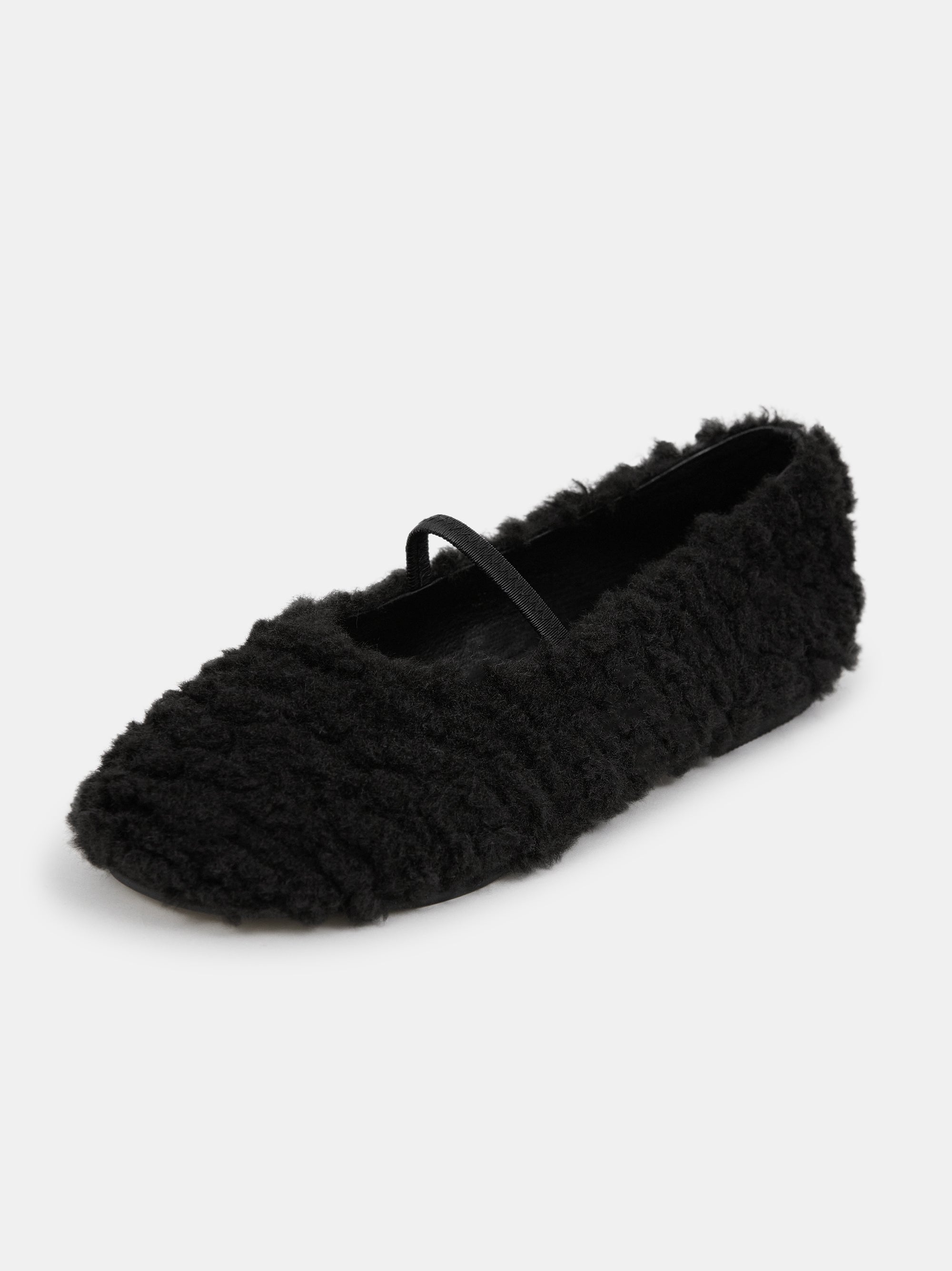 Black flats with store fur